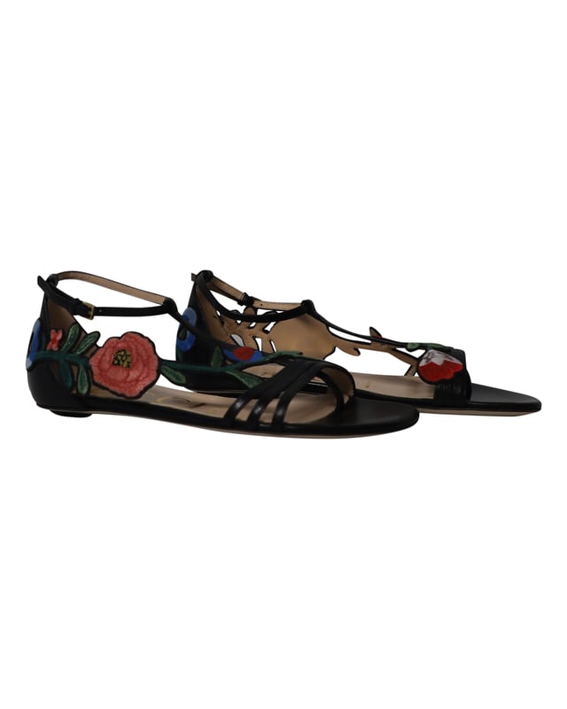 VINTAGE, RRP AS NEW
Wear luxury with a touch of high-fashion by choosing these black flats from Gucci. They are crafted from leather in an open toe T-strap silhouette and detailed with floral embroidered patches that extend from the vamps to the counters. They are complete with buckled ankle straps and comfortable leather-lined insoles.

Gucci Ophelia Floral-Embroidered Flat Sandals in Black Leather 
Material: Leather
Color: Black
Size: IT35/UK2
Condition: Excellent
Sign of wear: No
SKU: 252653
