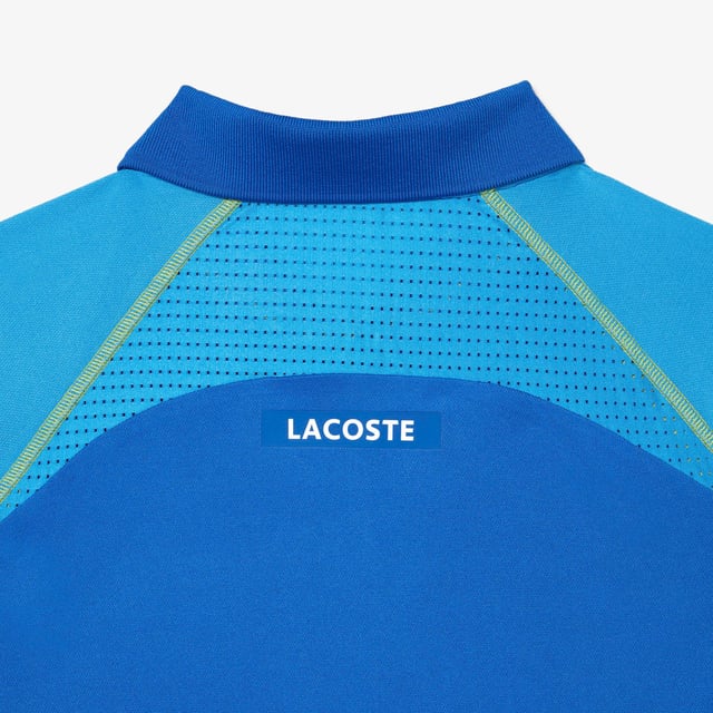 Performance & Assets Players The player’s offer is the perfect outfit to perform on court. It’s a mix of heritage’ Lacoste design and technical fabrics. Regular fit: natural ease on body Team Lacoste Players' polo dedicated to ATP tournaments New light piqué knit for a maximum of comfort during your matches under high temperatures Functional mesh panels at sides and back for breathability Ultradry property : moisture management performance you need to play at your best Eco responsible fabric : recycled polyester Contrasted flat seams in order to reduce skin irritation when you play New green silicone crocodile New grand tournament Lacoste wording at back neckline with herringbone effect