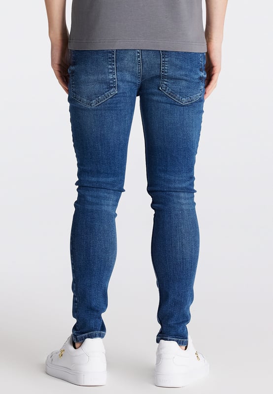 inchBoys Essential Midstone Skinny Denim JeanStretch DenimButton Waist with Belt LoopsTan Pu Patch With LogoMachine Wash98% Cotton 2% Elastane inch