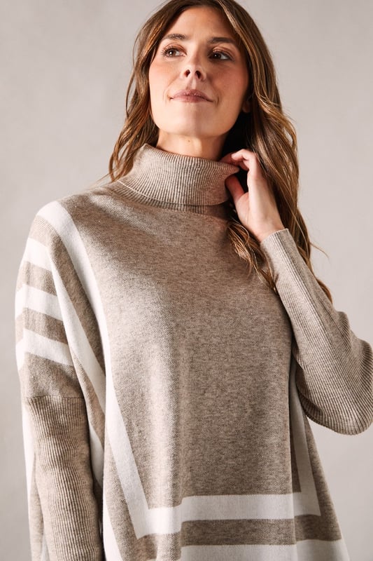 Chic striped roll neck poncho design
        Oversized, relaxed fit for ultimate comfort
        Elegant contrasting stripe pattern
        Long sleeves with dropped shoulders
        Versatile length suitable for various styling options
    
    Embrace sophistication and comfort with this striking striped roll neck poncho from Wallis. The oversized silhouette offers a relaxed fit, perfect for those who appreciate both style and ease. The elegant contrasting stripe pattern adds visual interest, while the long sleeves with dropped shoulders contribute to its laid-back charm. Ideal for casual events and family gatherings, this versatile piece can be styled effortlessly. Pair it with slim-fit trousers and ballet flats for a polished daytime look, or layer it over a fitted dress with ankle boots for a more refined ensemble. The poncho's adaptable length allows for various styling possibilities, making it a wardrobe staple for the fashion-forward woman who values both glamour and practicality in her everyday attire.