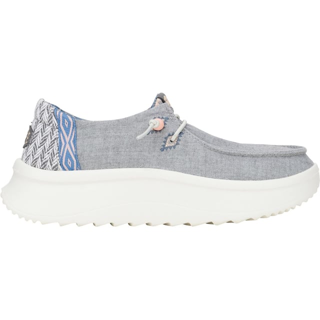Up your style game with Wendy Peak Chambray Woven. Added, cushy comfort and height meets woven textile heel and webbing details for the perfect mix of comfort and style. So easy to put on you'll never wanna take 'em off.