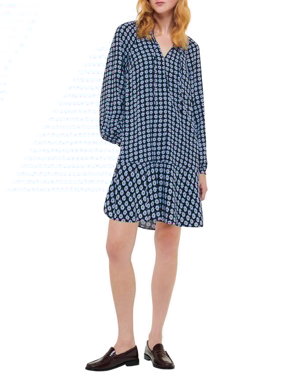 Embrace elegance with the Dot Flippy Dress, perfect for any occasion with its charming floral dot pattern and flippy hem.