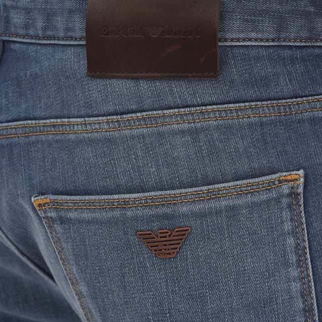 Mens Emporio Armani J06 Slim-Fit Washed Jeans in blue.- Five-pocket styling.- Zip fly and button fastening.- Belt loops.- Leather brand patch.- Metal rear pocket eagle.- Slim fit.- 98% Cotton  2% Elastane.- Ref: 8N1J061G0LZ943