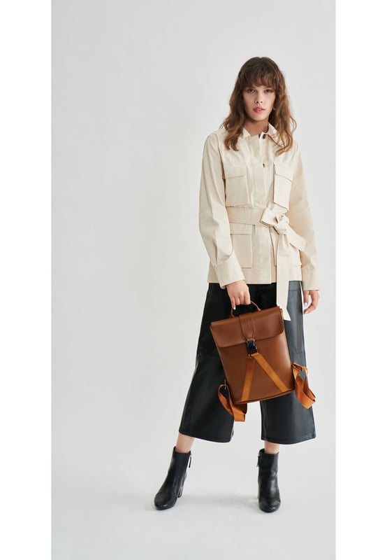 This contemporary style is perfect for those seeking practicality with style. Crafted with smooth leather, the bag oozes premium quality with a flap over front with gunmetal clip buckle and a leather grab handle. The premium nylon webbing shoulder straps are adjustable, providing comfort for the wearer as well as being durable. Inside reveals signature Smith & Canova lining and zip and fold pockets for any valuables. The exterior features a Smith & Canova debossed logo as well as an extra zip pocket. Features: , Smooth leather, Smith and Canova debossed logo, Flapover front with clip buckle fastening and nylon webbing, Gunmetal hardware, Leather grab handle, Adjustable premium nylon webbing shoulder straps, Smith and Canova signature lining, Internal zip and fold pockets, Padded 9 inch tablet slip pocket with Velcro tab fastening, External vertical zip pocket on the back, Smaller size Style Ref: 93056 TAN