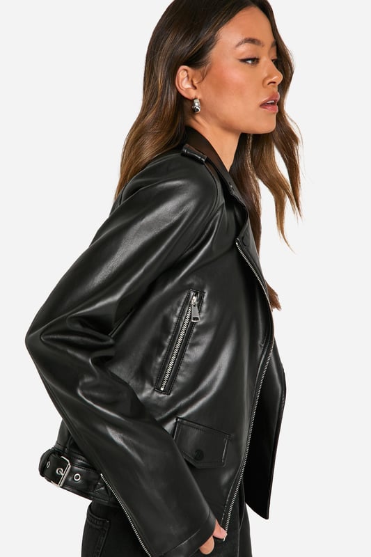 Classic biker jacket silhouette with notched lapels
        Asymmetrical front zip closure for edgy appeal
        Multiple functional zipped pockets for practicality
        Adjustable waist belt for a customised fit
        Long sleeves with zip cuffs for added style
    
    Embrace your inner rebel with this timeless tall biker jacket from Boohoo. Perfect for the fashion-forward woman who craves versatility, this jacket effortlessly transitions from day to night. Style it with wide-leg trousers and trainers for a casual daytime look, or throw it over a mini dress and ankle boots for an evening out with friends. The jacket's sleek silhouette and edgy details make it an ideal choice for family gatherings or casual events where you want to make a statement without overdoing it. Its adaptable nature allows you to create countless outfits, ensuring you're always on-trend and ready for any occasion. Easy to maintain with a simple wipe-down, this jacket is a practical yet stylish addition to your wardrobe that will serve you well for seasons to come.