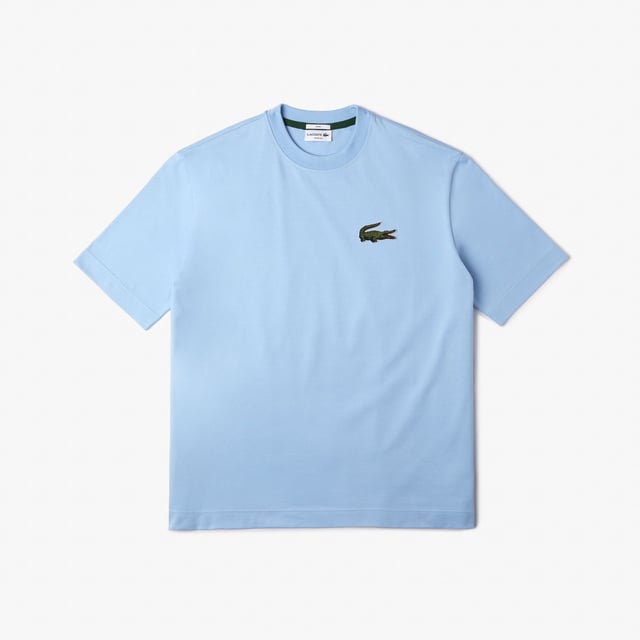 Finest materials. Brand’s singular expertise. The perfect expression of Lacoste’s timeless wardrobe -Loose fit is loose ease on body and sleeves  lower shoulders and armholes -Unisexe T-shirt in organic heavy jersey with big croc 80' on chest -7cm iconic original badge crocodile at chest -3cm green crocodile at under middle back collar