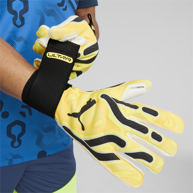 PRODUCT STORY: The new ULTRA ULTIMATE HYBRID goalkeeper gloves are designed to meet every need of the modern keeper. Featuring a lightweight fabric and in using the exclusive GRDXKN print technology, the glove is extremely lightweight and flexible. With the newly designed backhand, each section has a specific treatment to improve the performance of grip, cushioning and ball control, no matter the conditions. DETAILS: 4mm Superior grip latex palm made of renewable raw materials provides fantastic grip in both wet and dry conditions; Gunn/Negative-mixed palm cut provides additional grip and improved fit; Weight-reduced body material allows perfect agility and enhance breathability; Printed backhand using the exclusive GRDXKN print technology provides grip and additional support when punching the ball; Thumb wrap increased latex to ball contact; Elasticated wrist with full length latex strap provides wrist support and a secure closure.