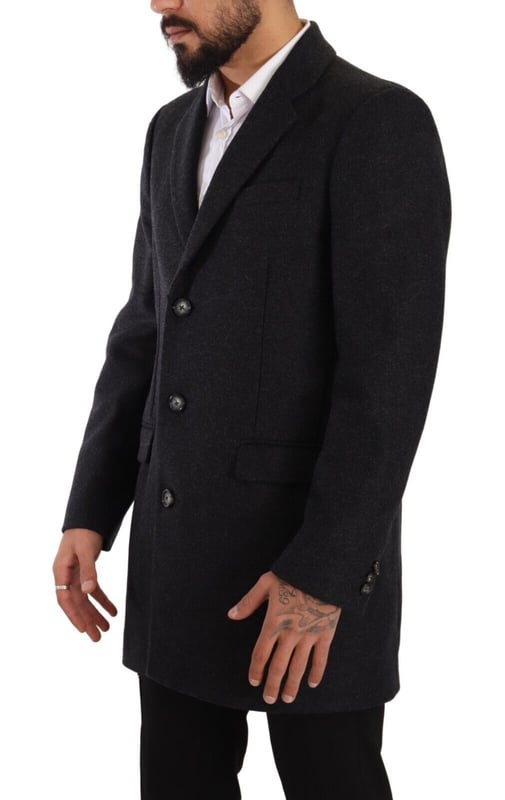 100% Authentic Dolce & Gabbana Single-breasted virgin wool coat
  Made from a blend of 80% Virgin Wool and 20% Nylon
  Dark grey color for a sophisticated look
  Three-button closure
  Logo details
  Made in Italy
  Lined with 50% Viscose and 50% Acetate fabric blend
  Quality craftsmanship