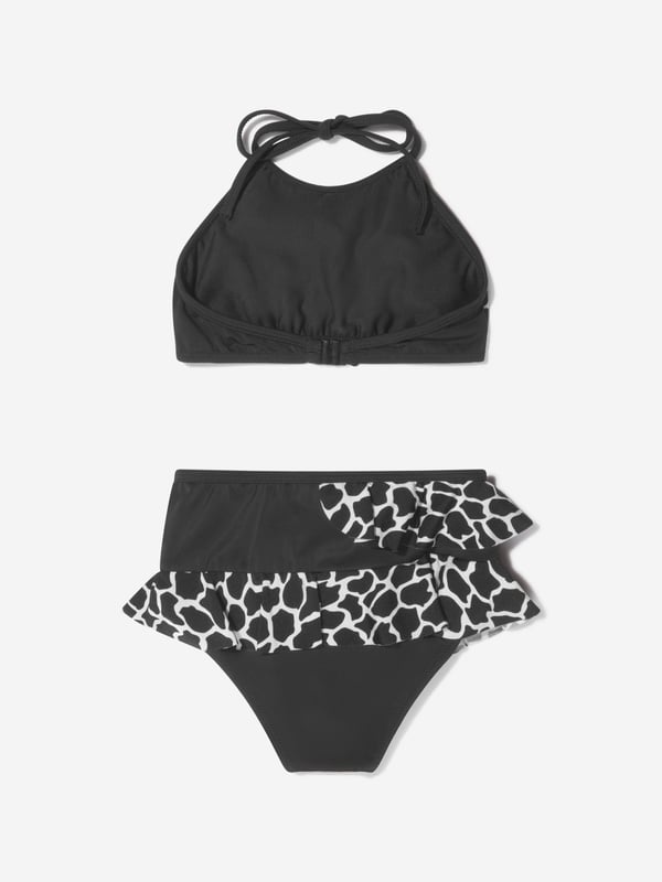 Unveiling the Girls Tinto Bikini (UV50 Sun Protection) by Nessi Byrd, an ultimate showstopper for your little girl's summer wardrobe. Key features: Elegant Design: Crafted to perfection with a designer finish, mixing style with sun protection for your little diva.  UV50 Sun Protection: Maximum protection against harmful sun rays, offering carefree fun under the sun. Luxurious Comfort: Made from unique, high-end fabric for unrivalled comfort and durability, withstanding countless beach adventures.  Unrivalled Quality: A product of Nessi Byrd's renowned quality, prepare to dazzle at the beach with this designer piece. Order now, upgrade your little girl's summer style!