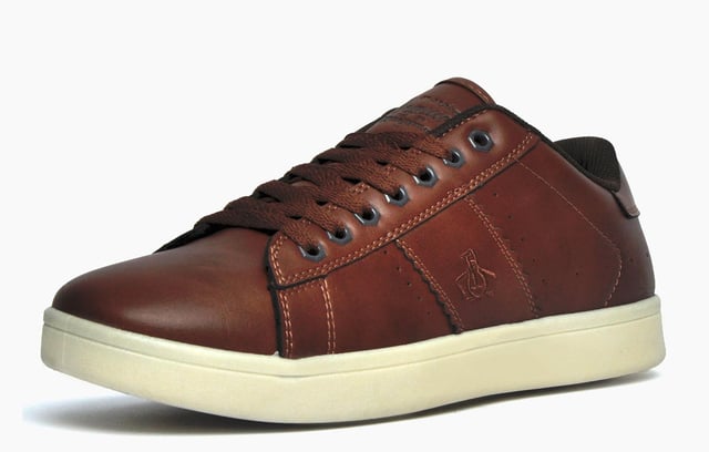Tap into sleek, contemporary casual style with these Steadman designer trainers from iconic menswear brand, Original Penguin. The Penguin Steadman is a sleek and refined everyday trainer thats packed full of authentic American retro styling. Bringing heritage inspired style to your casual outfits, the Penguin Steadman is a versatile choice for the new season. Crafted from a synthetic leather-look upper and featuring intricate stitch and panelled detailing to the sides, and finished with Penguin branding to the tongue, side and heel, this is a must have trainer for any stylish man looking to elevate his casual look.
 - Synthetic upper
 - Memory foam sockliner
 - Textured wrap around outsole
 - Intricate designer stitch detailing
 - Panelled trims and overlays
 - Sumptuous memory foam footbed
 - Classic lace up fastening
 - Original Penguin branding throughout