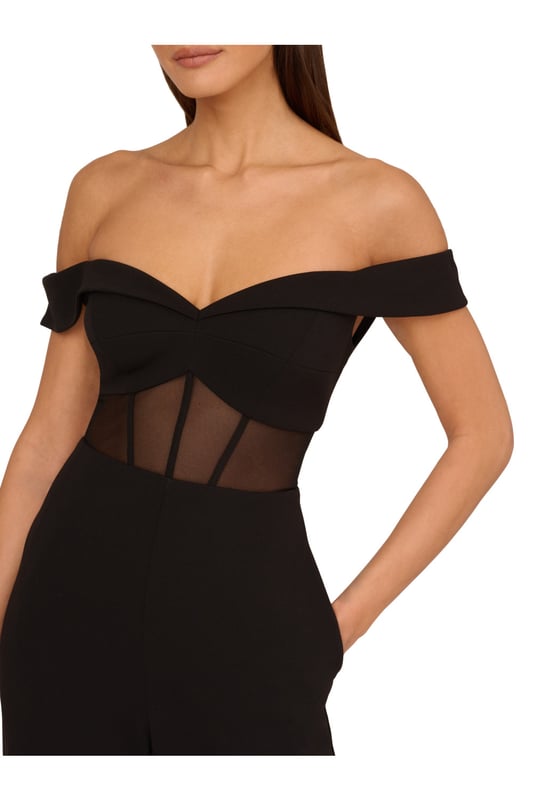 Go boldly to your next event in this sexy jumpsuit. This jumpsuit features an off the shoulder bodice with sweetheart neckline, wide leg trousers, and a sheer panel at the waist with boning construction for a corset effect. Crafted from knit crepe fabric, this eye-catching jumpsuit has some stretch. A stunning choice for every formal or black-tie affair, this off the shoulder jumpsuit is easy to style with your favourite neutral heels and simple metallic jewels. A zipper closure at the centre back completes this corset jumpsuit.