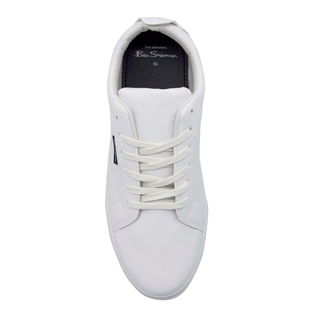 Ben Sherman Mickey Mens White Trainers Get ready to step into a world of timeless style and contemporary comfort with the Ben Sherman Mickey Men's White Trainers. Inspired by the iconic British fashion brand's heritage, these trainers effortlessly blend classic design elements with modern touches, making them a must-have addition to your casual footwear collection.
Key Features:
Classic White Design: The Ben Sherman Mickey Trainers come in a clean and classic white colorway, ensuring versatility and easy pairing with a wide range of outfits. This timeless design makes them suitable for various occasions, from casual outings to semi-formal events.
Sleek Silhouette: These trainers feature a sleek and streamlined silhouette that exudes sophistication and elegance, allowing you to make a subtle yet stylish statement wherever you go.
High-Quality Construction: Known for their commitment to quality, Ben Sherman has crafted these trainers using premium materials, ensuring durability and long-lasting performance.
Comfortable Fit: The Mickey Trainers are designed with your comfort in mind. The padded collar and cushioned insole provide excellent support and all-day comfort, making them perfect for extended wear.
Signature Branding: Ben Sherman's iconic branding elements, such as the logo and signature accents, add a touch of authenticity to these trainers, showcasing your appreciation for classic British fashion.
Versatile Styling: Whether you're dressing up for a casual day out or keeping it laid-back with jeans or shorts, the Ben Sherman Mickey Trainers effortlessly complement various outfits, adding a touch of sophistication to your ensemble.
Durable Outsole: The trainers feature a sturdy and grippy outsole, providing reliable traction and stability, making them suitable for everyday wear.