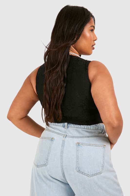Update your wardrobe with this plus size bodysuit from our dedicated curve range. A form fitting, curve enhancing style with a press-stud fastening, this piece can be dressed up or down, depending on the vibe. Team with coated jeans and statement heels for date night plans, or pair with tailored trousers for a brunch date with your bestie. For an instant fresh 'fit, a plus size black bodysuit is perfect to replace your go-to t shirts. Got a date night planned? Team a dreamy plus size lace bodysuit with a leather skirt and standout heels.Style: BodysuitFabric: LaceSleeve Length: Sleeveless