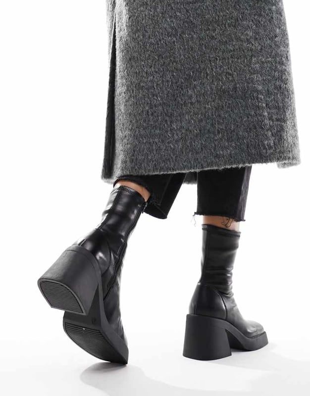 Shoes by ASOS DESIGN Reboot in progress Zip-side fastening Sock-like cuff Square toe Chunky sole Mid block heel Wide fitSold By: Asos