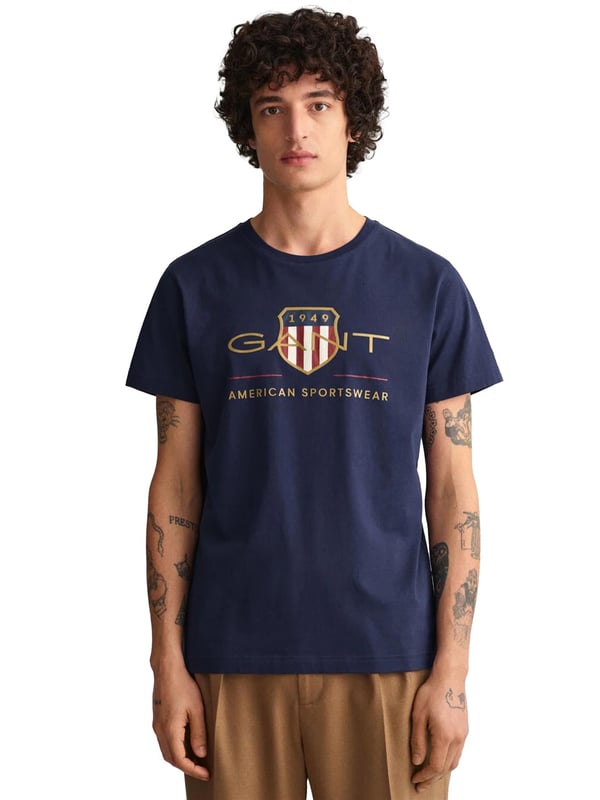 Mens Designer Gant Archive Shield T-Shirts feature Short Sleeves and a Crew Neckline. Gant Logo Printed on chest. Crafted With 100% Cotton, these Lightweight and breathable Regular Fit T-shirts are Machine Washable.