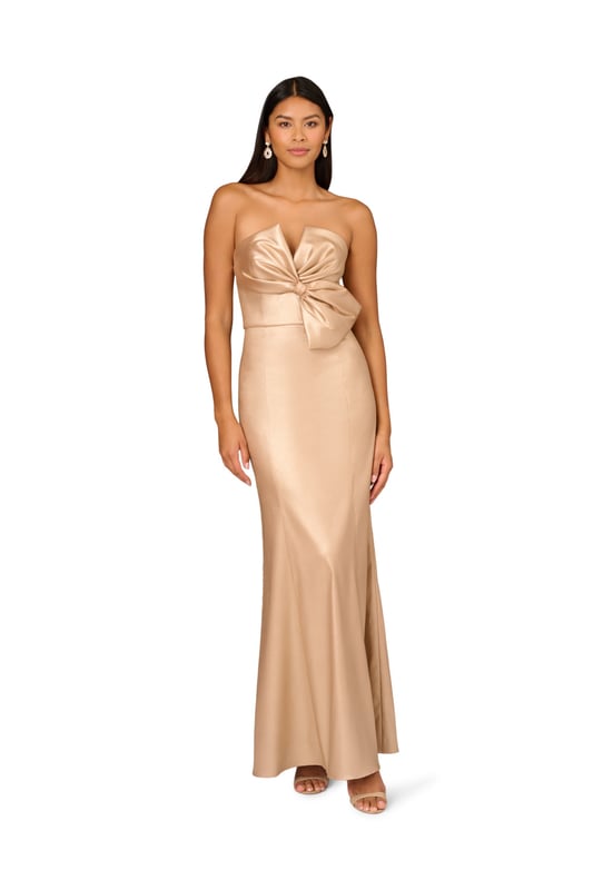 Foiled stretch Mikado, strapless notch neckline featuring a bodice bow detail, mermaid skirt and back zipper