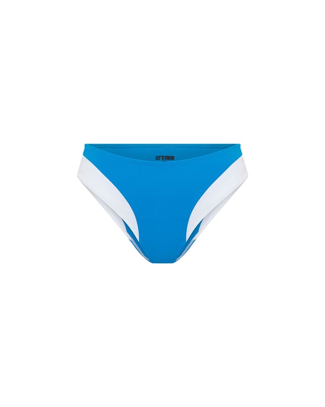 This hipster bikini bottom seamlessly combine style and function, with a blue Brazilian style silhouette and contrasting white contour panelling for fuller coverage. Between sunlounger and jetski or deep diving to the ocean floor, this sustainable piece works everywhere. Pair with the matching blue wired balconette bikini top for the full look.