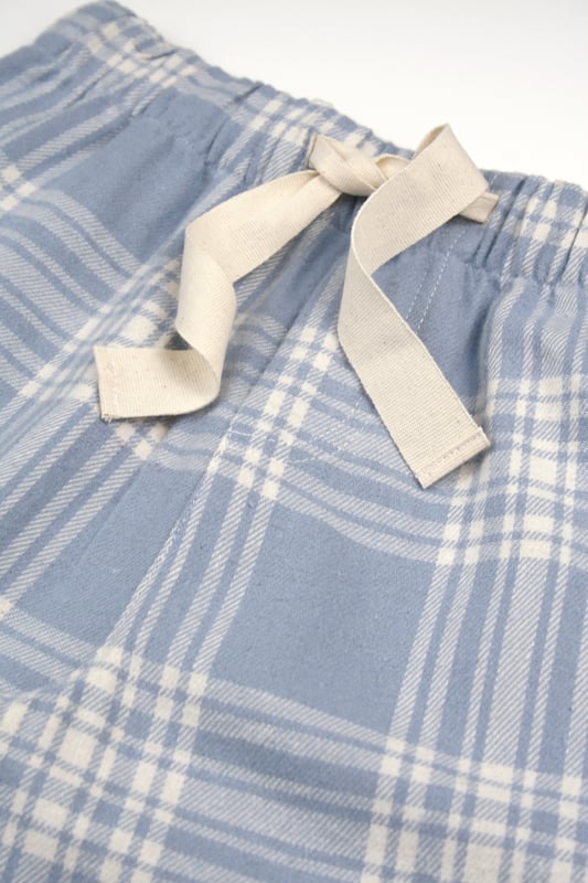 Introducing our Cotton Check Lounge Pants, the ultimate blend of comfort and style. Made from soft, breathable cotton, these lounge pants feature a classic check pattern that adds a touch of sophistication to your relaxation wardrobe. Perfect for lounging at home or casual outings, they offer an easy fit with an elastic waistband and pockets for added convenience. Ideal for year-round wear, our cotton check lounge pants are a must-have for anyone seeking cosy, fashionable loungewear. Embrace comfort without compromising on style with these versatile pants!