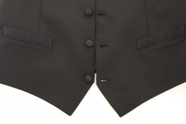 <p>Dolce &amp; Gabbana Vest</p>
<p>Absolutely stunning, 100% Authentic, brand new with tags Dolce &amp; Gabbana black wool silk blend stretch Dress Vest. This item comes from the MainLine Dolce &amp; Gabbana collection.</p>
<p>Modell: Single breasted<br />
Strap: Adjustable back waist strap<br />
Color: Black<br />
Full front button closure<br />
Logo details<br />
Made in Italy</p>
