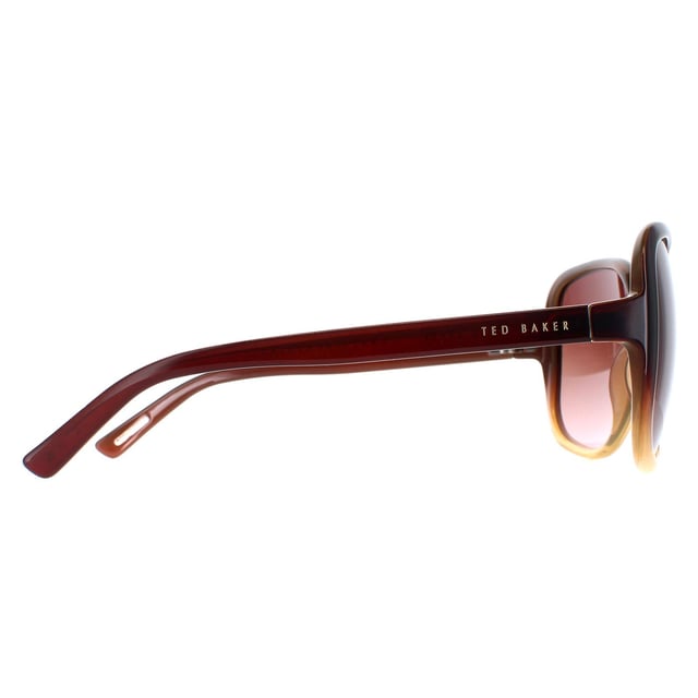 Las gafas de sol Ted Baker TB1312 Krash 142 negro marrón son un accesorio elegante y con estilo que elevará cualquier look. Estas gafas de sol tienen un diseño de mariposa que les da un aspecto moderno y sofisticado. Perfectas tanto para ocasiones informales como formales, estas gafas de sol son toda una declaración de estilo. El logotipo de Ted Baker aparece en las finas patillas para garantizar la autenticidad de la marca.