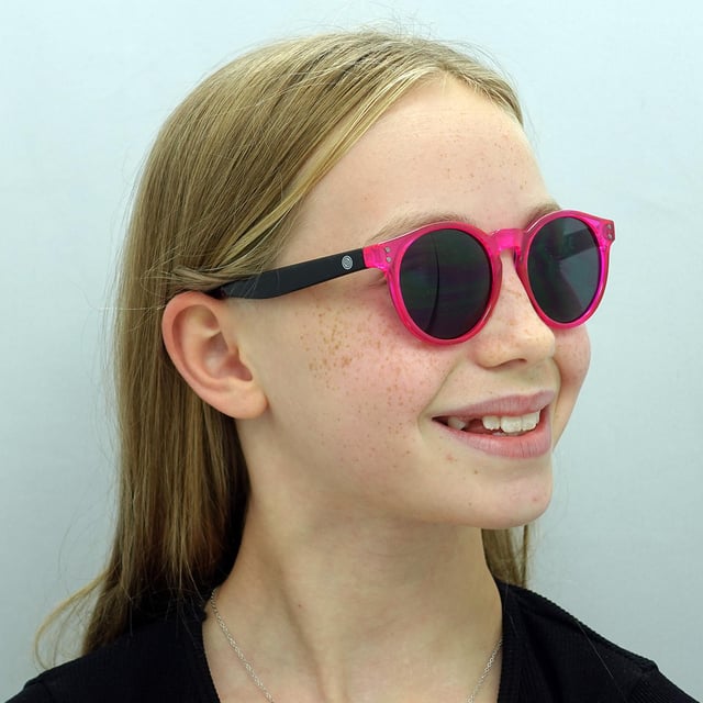Smarty Round Kids Transparent Pink Black Grey X2944  Sunglasses Brighten your child's look with SMARTY Designer Sunglasses model X2944E, perfect for kids aged 3 to 7 years old. These round-shaped sunglasses feature a playful pink frame with durable plastic arms and grey lenses, providing superior UV protection and a fun, stylish appearance. The X2944E model combines trendy design with kid-friendly comfort and durability, making them ideal for any sunny day adventure. Available at an unbeatable discount from the regular retail price, these designer sunglasses offer exceptional quality and value. Give your child the perfect blend of style and protection with SMARTY sunglasses.