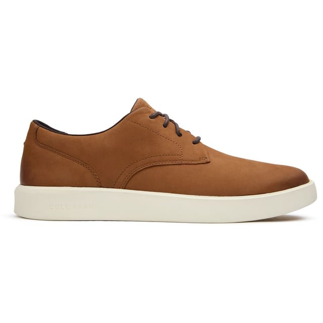Mens tan Cole Haan grand crosscourt daily shoes, manufactured with nubuck and a rubber sole. Featuring: grand 360 sole, cole haan branding, lightweight and padded heel collar.