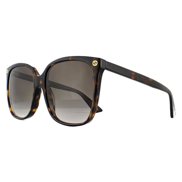 Die Gucci GG0022S 003 Havana Grey Gradient Sonnenbrille hat eine einfache quadratische Form mit eleganten GG-Logos an den vorderen Tempeln und einem Bienendetail an der Tempelspitze.