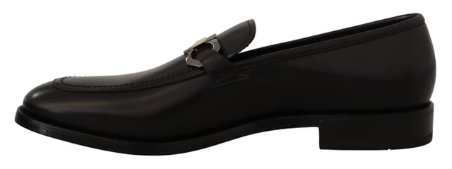 Brand new with tags and dust bag
  100% authentic Salvatore Ferragamo mens shoes
  Model: Lewis
  Color: Black
  Material: 100% Calf Leather
  Formal version of the gentlemens loafer
  Calf leather tumbled and hand buffed for depth of color
  Gancio bit in cool palladium finish
  Open grooves reveal stitching on leather sole
  Made according to Originali construction method
  Made in Italy
Material: Calf Leather