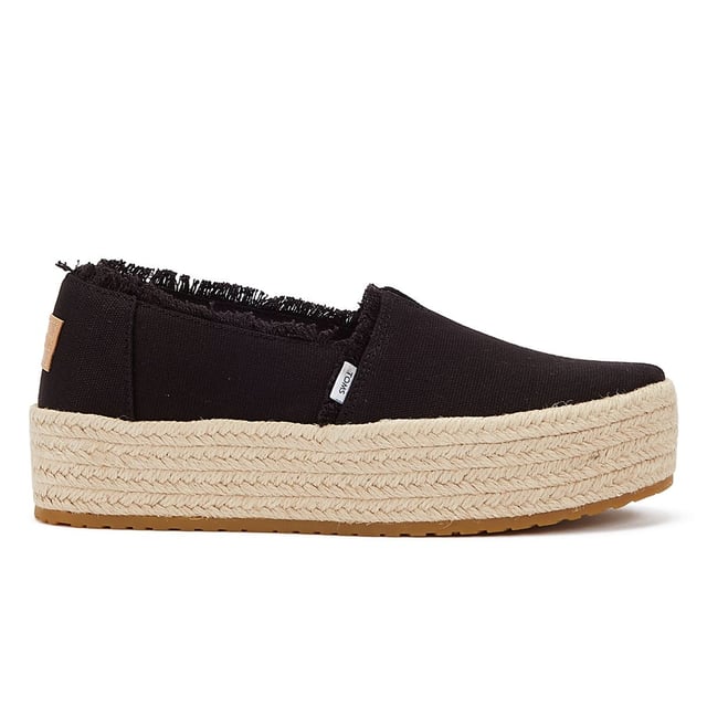 Elevate your style with these trendy espadrille platform slip-ons, featuring stylish textile uppers. The rope wrap platform adds a touch of sophistication to these shoes. Enjoy superior comfort with the padded heel that cushions your feet with every step. The OrthoLite Eco LT Hybrid insoles are made with 26% eco content, including 15% waste foam, 5% recycled materials, and 6% bio-oils, ensuring both comfort and sustainability. The rubber outsole offers excellent grip and durability. With an outsole height of approximately 1.5 inches, these slip-ons provide the perfect amount of elevation. Rest assured, these shoes are completely vegan, catering to your ethical choices. Step out in style and comfort with our exceptional espadrille platform slip-ons.