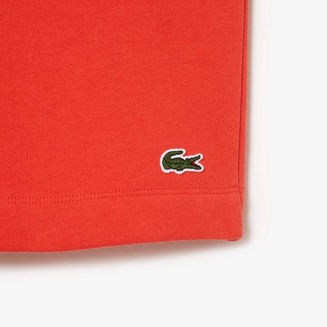 Men's Lacoste Organic Brushed Cotton Fleece Shorts Regular fit  straight cut: Unrestricted movement. Drawstring at waist: An adjustable waistband for optimal comfort. Piped back pocket: Practical and functional. Embroidered crocodile sewn onto front: Lacoste signature performance. Brushed organic cotton fleece: Long-lasting comfort during practice.