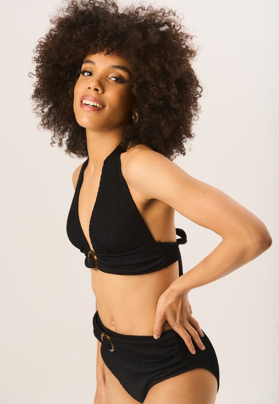 These Textured High Waisted Bottoms are a must-have for any fashion-forward wardrobe. The ring belt detail adds a unique touch to these already chic bottoms. Stay comfortable and stylish all day long with these trendy high waisted bottoms.