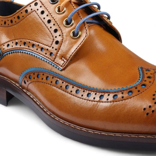 Elevate your formal style with the Justin Reess Simon Men's Brown Brogue Leather Shoes. These classic brogues feature decorative perforations and intricate detailing along the upper, adding a refined touch to any outfit. Made from premium leather, they offer durability and comfort for all-day wear. The lace-up closure ensures a secure, customizable fit, perfect for business meetings, weddings, and other formal occasions. These versatile shoes are a must-have addition to your wardrobe, seamlessly complementing any formal ensemble.

Classic Brogue Design with decorative perforations
High-Quality Leather Construction for durability and style
Lace-Up Closure for a secure, adjustable fit
Versatile Formal Wear suitable for various occasions