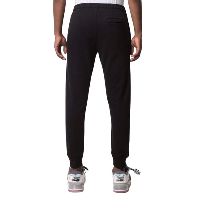Veredeln Sie Ihren Stil mit der schwarzen Jogg-Hose. Diese bequemen, cremefarbenen schwarzen Hosen bieten einen eleganten und vielseitigen Look, perfekt für jeden Anlass. Egal, ob Sie ins Fitnessstudio gehen oder Besorgungen machen, diese Shorts bieten sowohl Stil als auch Funktionalität. Werten Sie Ihre Garderobe noch heute auf!, Elastischer Bund und Beinabschlüsse, schlichte Hose, 100 % Polyester, Streetwear, hergestellt in Italien, normale Passform