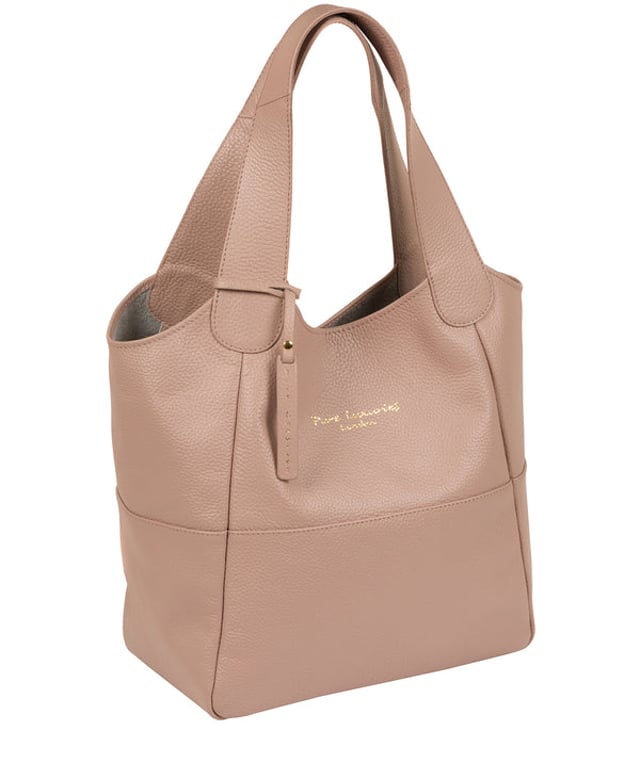 Crafted from supple natural leather, the 'Freer' tote bag from Pure Luxuries London is perfect for any occasion, day or night. The main compartment comes with an unlined and exposed leather interior for a soft to the touch feel with plenty of space for your essential items. A simple and elegant design with a beautifully soft pebble grain finish that is adorned with matching leather carry handles and furnished with the gorgeous Pure Luxuries London hnging charm and embossed logo.