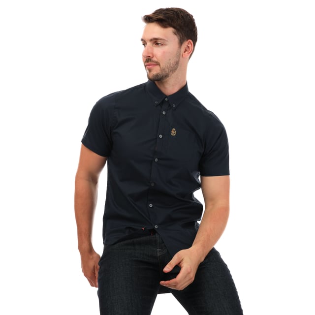 Mens Luke 1977 Iron Bridge Short Sleeve Shirt in navy.- Button down collar.- Short sleeves.- Chest pocket.- Button fastening.- Embroidered branding.- Shaped hem.- 98% Cotton  2% Elastane.  - Ref: M590802NAVY