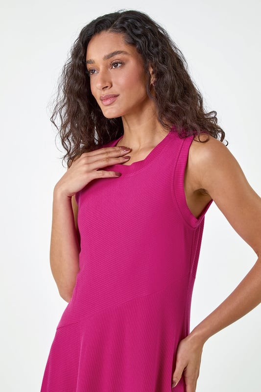 Asymmetric Sleeveless Stretch Midi Dress from Roman. Keep your style simple and chic this season with this sleeveless Dusk midi dress. Cut from a comfortable stretch jersey fabric, this dress features a modest round neckline and a Summer ready sleeveless style. Cut in a flattering fit and flare shape with a floaty asymmetrical hemline, this dress is designed to pull-on for quick and easy dressing. Falling to a modest midi length with a unique diagonal dropped waist, this dress can be dressed up or down to suit any occasion. Add sandals and sunnies for a simple Summertime look!