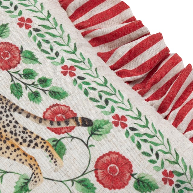 Add a stylish touch to your living space with the Okara Leopards Printed Ruffle Cushion. Featuring an exquisitely hand-painted design inspired by Indian Chintz, this cushion combines painterly florals with a striking mirrored print of jungle creatures, creating a sophisticated yet vibrant statement piece. The textured fabric and versatile colour palette enhance its modern appeal, while the striped frill trim adds an effortless charm that blends relaxed style with refinement. Perfect for those who appreciate the art of print and pattern, this cushion effortlessly elevates interiors with a tasteful nod to nature's beauty.