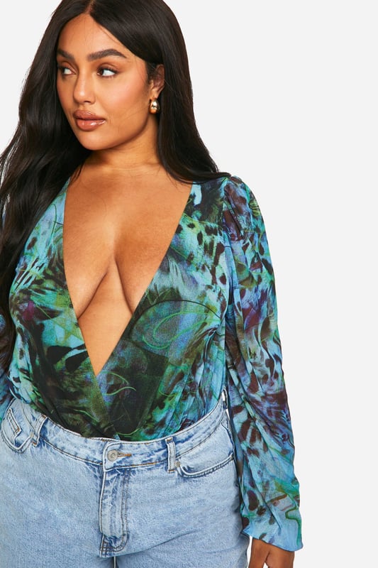 Plus Animal Wrap Mesh Bodysuit Update your wardrobe with this plus size bodysuit from our dedicated curve range. A form fitting, curve enhancing style with a press-stud fastening, this piece can be dressed up or down, depending on the vibe. Team with coated jeans and statement heels for date night plans, or pair with tailored trousers for a brunch date with your bestie. For an instant fresh 'fit, a plus size black bodysuit is perfect to replace your go-to t shirts. Got a date night planned? Team a dreamy plus size lace bodysuit with a leather skirt and standout heels.Style: BodysuitDesign: AnimalSleeve Length: Long Sleeve