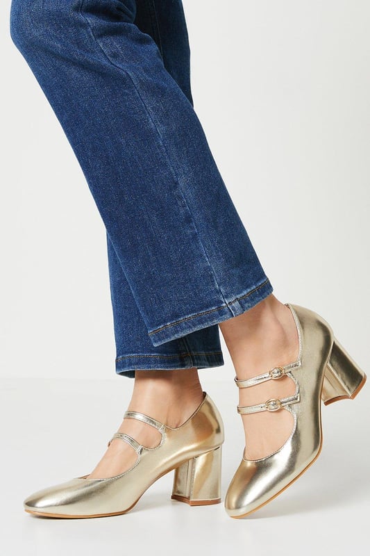 High-shine metallic finish
Block heel for stability  
Almond toe shape
Double Mary Jane straps with buckles
Reinforced heel cap for durability

These versatile metallic court shoes from Dorothy Perkins are perfect for both day and evening wear. Their contemporary double strap design with silver-toned buckles lends visual interest, while the mid-height block heel offers comfort and stability. 

Pair with cropped trousers or a flared skirt for a smart daytime look. For evenings out, match with a dress or trousers to complement the metallic shine. The reinforced heel cap gives durability for all-day wear. With their sleek silhouette and modern accents, these shoes will become a go-to in your wardrobe.
