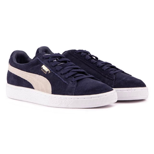 Die Puma Suede Classic ist eine ikonische Low-Rise-Silhouette, die die Bar für lässige Trainer Stile, hier für die jüngere Träger gesetzt hat. Diese Iteration verfügt über eine blaue Wildleder Obermaterial mit dem klassischen Puma Branding auf dem renommierten rutschfeste Gummilaufsohle.