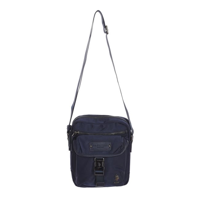 Men's shoulder bag from the U.S. POLO ASSN brand.
 Synthetic material exterior.
 Top zipper closure.
 Front Exterior: One zipper pocket and one buckle closure pocket.
 Rear exterior: One zipper pocket.
 Front interior: One zipper pocket, one open pocket and 4 pen compartments.
 Back interior: Two pockets with velcro closure.
 Adjustable strap.
 Interior lining with brand print.
 Brand logo on the front.
 Measures: 23x20x7cm
 Composition: 80% Nylon, 20% Polyurethane
 Care:
Clean with a wet cloth.