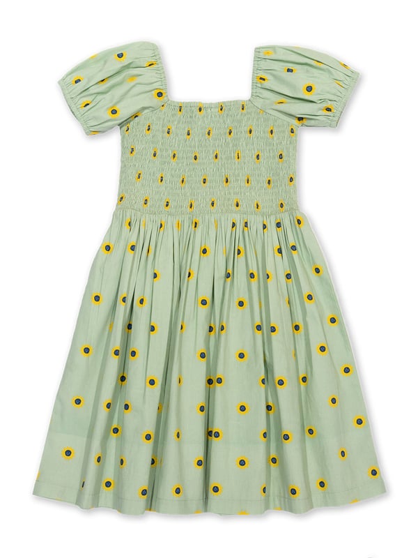 100% organic cotton | Proud to be certified to the Global Organic Textile Standard (GOTS) | Sunflower dot all-over print | Soft sage | Poplin fabric | Elasticated short sleeves | Square neck | Elasticated shirring at chest | Made in India | Machine washable at 40 degrees, or at 30 degrees to be kinder to the planet