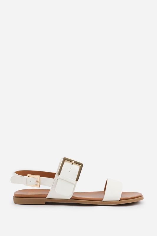 Wheres That From Womens 'Uma' Classic Flat Sandals With Strap And Buckle Detail Step out in style and comfort with our Uma Classic Flat Sandals with Strap and Buckle Closure. These sandals are the perfect combination of fashion and functionality, making them an essential addition to your footwear collection. With their classic design and strap and buckle closure, these sandals offer a versatile and timeless look suitable for any occasion.
Key Features:
Chic Design: These sandals feature a sleek and classic design that adds sophistication to your outfit. The strap and buckle closure detail adds a touch of visual interest, making these sandals stand out.
Comfortable Fit: The flat sole provides a comfortable and stable fit that is suitable for all-day wear. The buckle closure allows for an adjustable and secure fit, ensuring that these sandals stay comfortably on your feet.
Durable Construction: Crafted with high-quality materials, these sandals are built to last. The sturdy construction ensures durability and longevity, making them a reliable choice for regular wear.
Suitable for Any Occasion: Whether you're running errands, going for a walk on the beach, or simply want to elevate your everyday look, these sandals are suitable for any occasion. Their classic design and comfortable fit make them a versatile choice for all-day wear.
Specifications:
Material: Faux Leather.
Closure: Strap and buckle closure
Invest in our Uma Classic Flat Sandals with Strap and Buckle Closure for a fashionable and comfortable option for your feet. These sandals are designed to provide style, functionality, and all-day comfort, making them a go-to choice for any outfit and occasion.