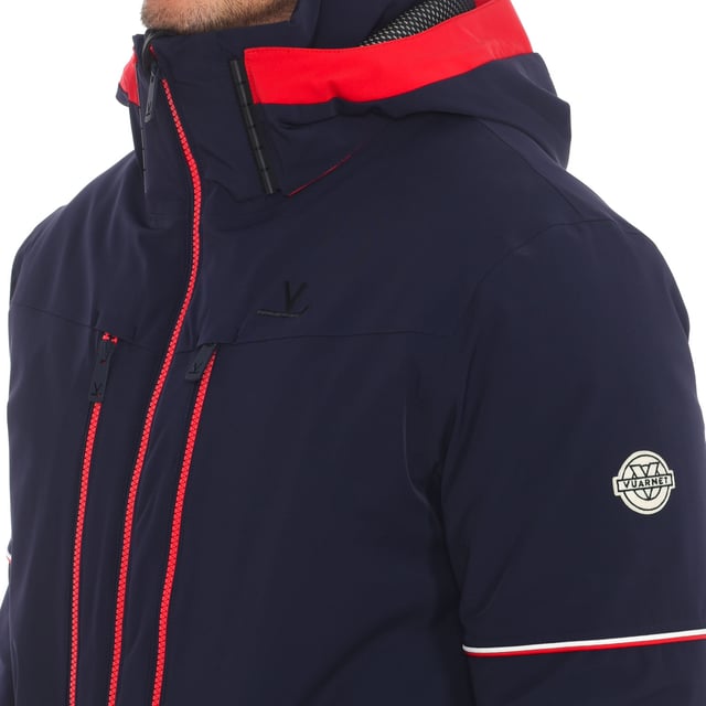 Ski jacket Vuarnet.
 Waterproofing: 20,000mm
 Breathability: 10,000mvp
 Waterproof zippers.
 Removable hood.
 Front zipper opening.
 One zipper pocket on each front side.
 One sleeve pocket with zipper.
 Two zippered hand pockets
 Two open internal pockets.
 Two internal zipper pockets.
 Includes glasses cleaning cloth in the interior pocket.
 Zipper cuff and internal jersey.
 Brand logo on one sleeve.
 Composition: 87% Polyamide, 13% Elastane
 Care:
Handwash.
 Do not use dryer.
 Do not iron.
 Do not use bleach.
 Do not dry clean.