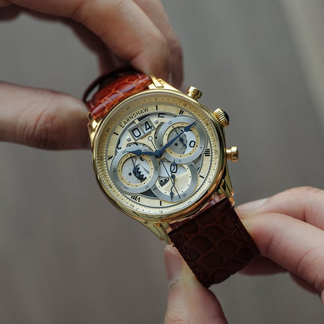 Collection: Nasmyth Grande Date Chronograph Japan Quartz Big Date
Model: Es-8260-04
Movement: Japan Quartz 
Case Material: Stainless Steel
Case Diameter (mm): 43
Case Thickness (mm): 15
Case Shape: Round
Case Color: Gold
Dial Color: Gold
Band: Genuine Leather Strap
Band Color: Tan
Buckle: Strap Buckle
Band Width (mm): 22
Water Resistance: 5 Atm
Watch Weight (g): 130
Warranty: 2 Years International Warranty