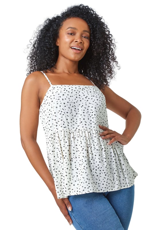 Ditsy Spot Print Peplum Vest Top from Roman. Only for our shoppers that want to be spotted! Dusk's disty polka dot cami is lightweight, breathable, and eye-catching. Cut to a peplum silhouette and finished with adjustable straps this square neck summer top is flattering for every body type. This piece can be worn however you like whether home or away.