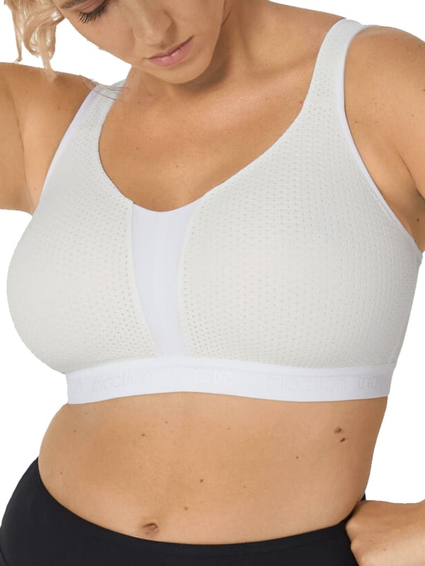 Triumph Triaction Energy Lite Sports Bra. Non-wired, shaped, spacer cups. Can be worn in a racerback style. Product is hand-wash only..