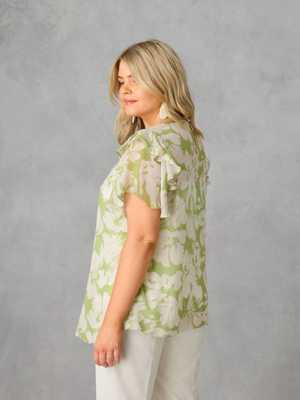 In a pretty green floral print, this blouse is cut from a soft, sheer chiffon, with a detachable jersey cami underneath for coverage. It has a round, gathered neckline, and angel sleeves with ruffle detailing. Keyhole and button fastening at the back neck add to its stylish feel, making this the perfect blouse to dress up or down.
