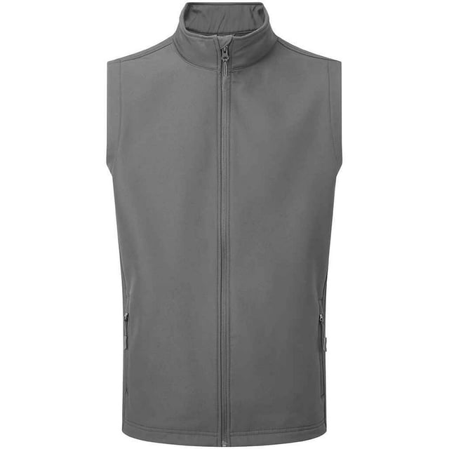 Material: 100% recyceltes Polyester. Innenfutter: Gebundenes Vlies. Gewebe: Doppellagig, Softshell. 280gsm. Muster: Einfarbig. Kinnschutz. Gewebe-Technologie: Easy-Clean, duschbeständig, wasserdicht, windbeständig. Ärmel-Typ: Ärmellos. Ausschnitt: Stehkragen. Taschen: 2 Fronttaschen, Reißverschluss, 2 Innentaschen. Verschluss: Durchgehender Reißverschluss. Saum: Kordelzug, Gummizug. Nachhaltigkeit: Amfori, BSCI, GRS zertifiziert.