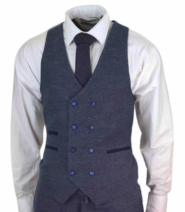 Mens 50% Wool Herringbone Tweed 3 Piece Suit Tailored Fit Complete With Blazer, Waistcoat & Trousers Sharp, sleek and sophisticated, look the part with this premium 3 piece Blue tweed suit, that features a Tailored Fit (inbetween Slim & Regular) with a closer fit across the chest and narrower tailored trousers. Crafted from 50% wool, the two-button jacket hangs beautifully and has a half canvas construction that moulds to your body shape the more you wear it. Contrasting flap pockets, buttoned cuffs and a single back vent lend the suit a classic touch of refinement. A matching tweed waistcoat completes the 3-piece with a Double Breasted Waistcoat Design With Contrasting Trim & Detailing. The suit is evergreen and contemporary at the same time and allowing you to look the best all day. Pair it with a matching waistcoat, a white shirt and shoes for a dapper finish. Perfect For Any Smart Formal Traditional Vintage Retro Themed Occasions, Such As Weddings, Proms Or Parties! Many More Styles & Colours Available in Store!